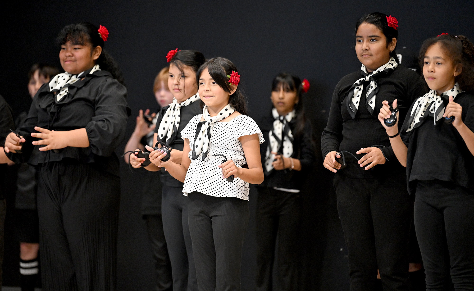 Raices students performing with castanets at Markham Elementary
